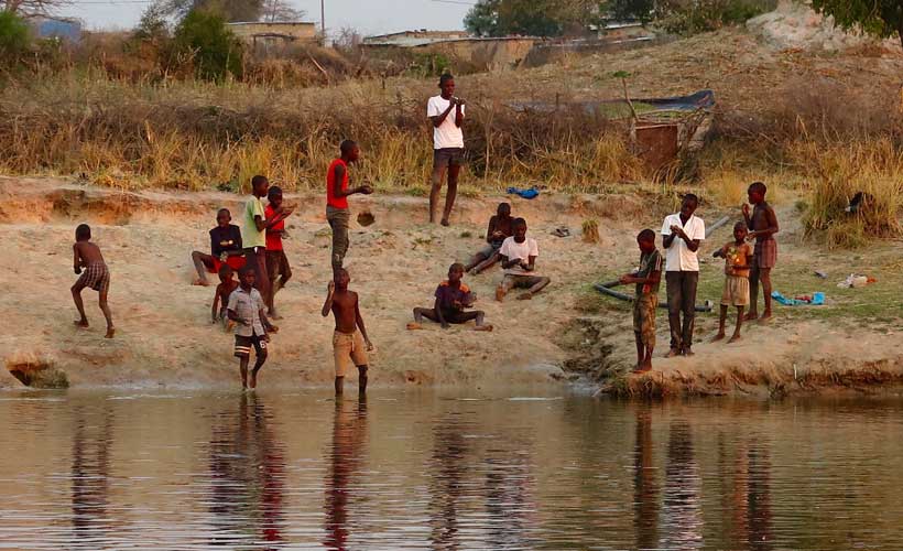 Group of locals on the bank of the Kvanga River Namibia